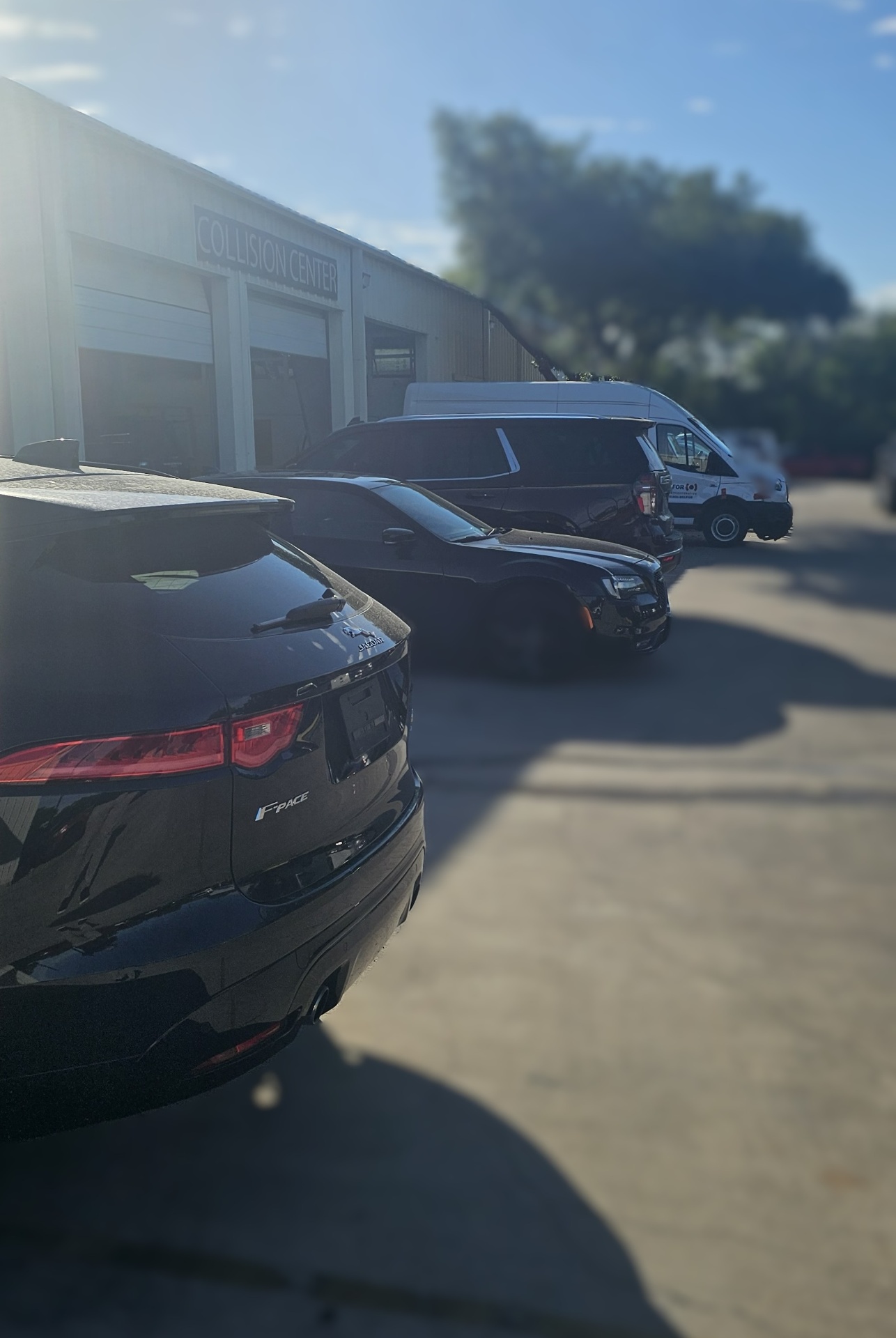 Mission Body Shop collision center exterior with vehicles staged for service